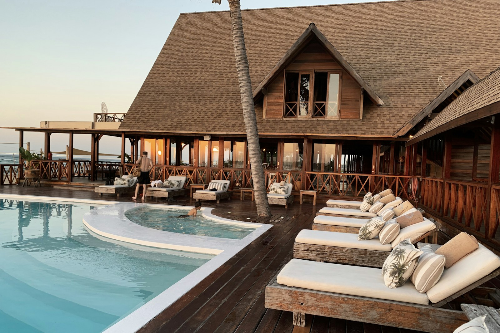 Coastal resort with timber architecture and a swimming pool