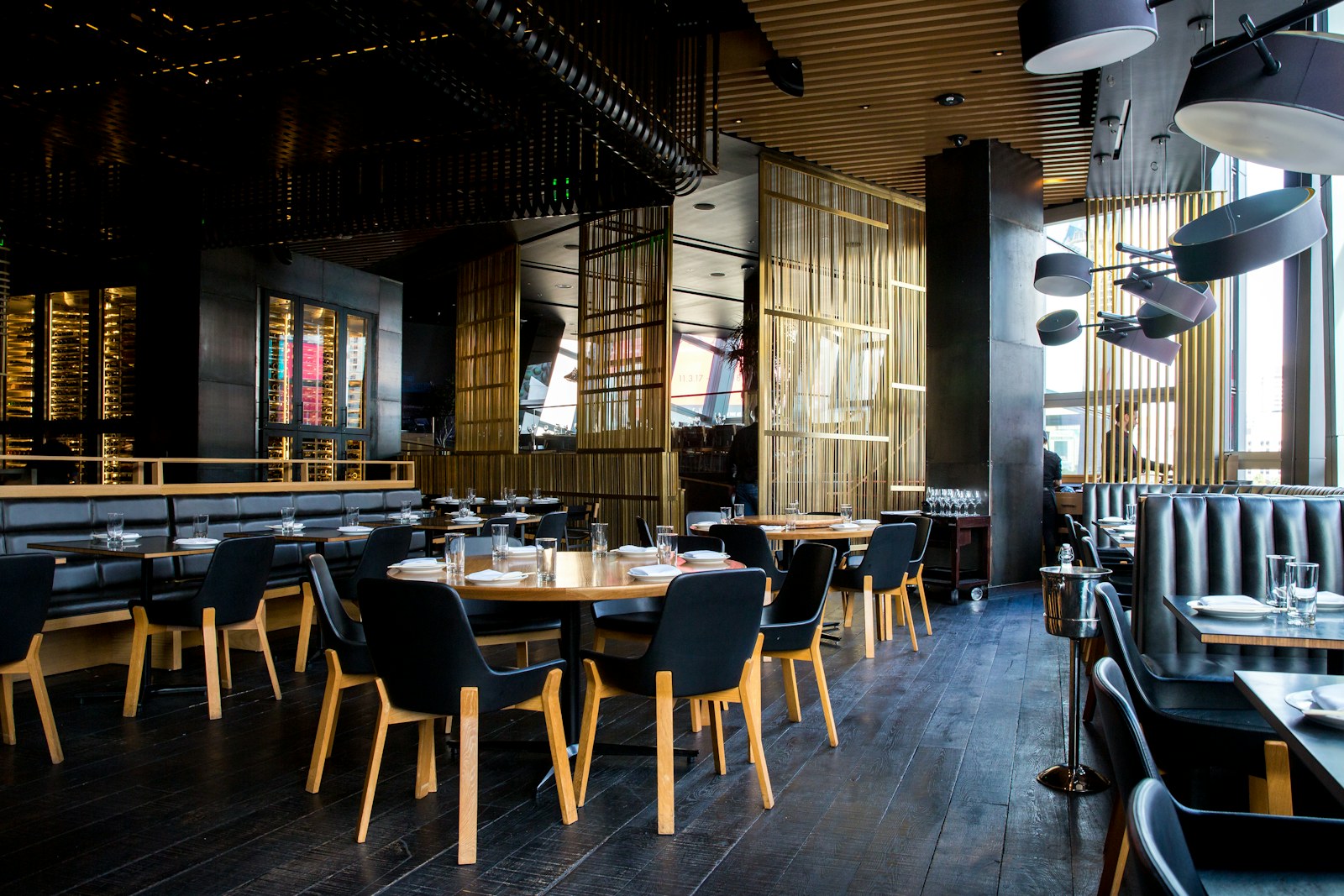 Warm restaurant interior set for dinner